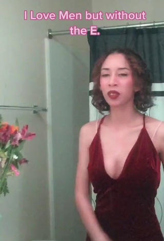 Erotic Aelest Shows Cleavage in Dress