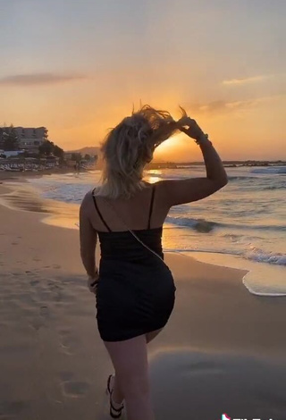 3. Irresistible Alina Mour in Black Dress at the Beach