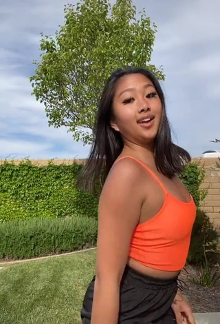 2. Really Cute Anneston Pisayavong in Orange Crop Top