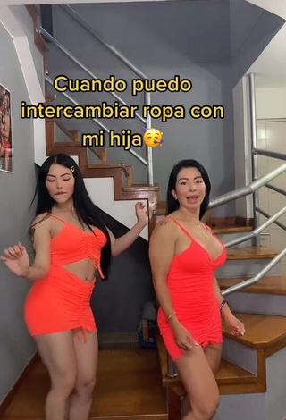 1. Irresistible Adriana Espitia Shows Cleavage in Electric Orange Dress