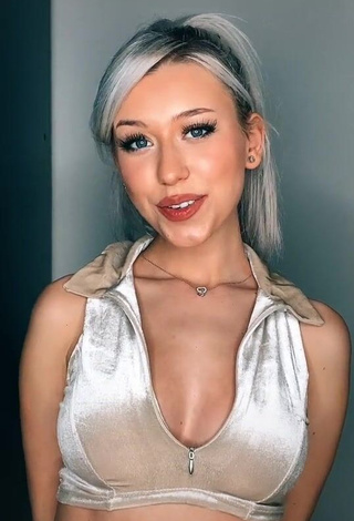 1. Erotic Alexis Feather Shows Cleavage in Silver Crop Top