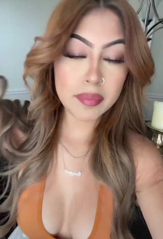 1. Desiree Montoya Shows Cleavage in Cute Orange Crop Top