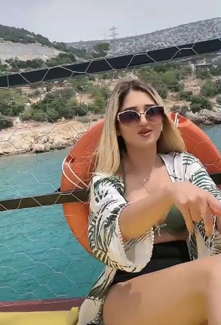 1. Erotic Eda Aslankoç Shows Cleavage in Olive Bikini on a Boat