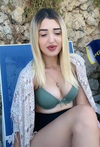 Erotic Eda Aslankoç Shows Cleavage in Olive Bikini Top