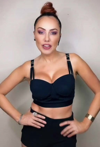 Erotic Erika Shows Cleavage in Black Crop Top