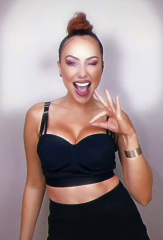 3. Erotic Erika Shows Cleavage in Black Crop Top