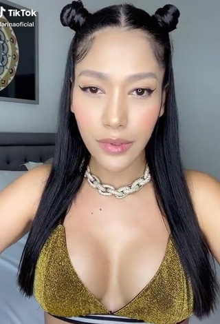 1. Irresistible Farina Shows Cleavage in Golden Bikini Top