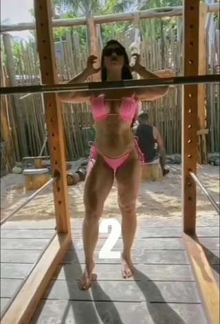 1. Gorgeous Franjomar Shows Cleavage in Alluring Pink Bikini while doing Fitness Exercises