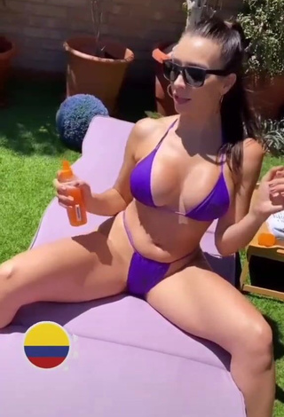 1. Captivating Franjomar Shows Cleavage in Violet Bikini