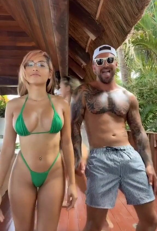 1. Erotic Maddy Belle Shows Cleavage in Green Mini Bikini