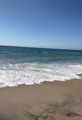 Wonderful Maddy Belle Shows Cleavage in Bikini at the Beach