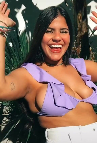 Julia Antunes Shows Cleavage in Erotic Purple Bikini Top