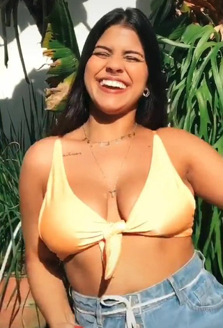 2. Alluring Julia Antunes Shows Cleavage in Erotic Yellow Bikini Top