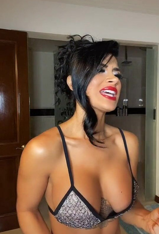 Sexy Kimberly Flores Shows Cleavage in Silver Bikini Top