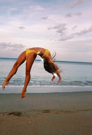 3. Fine Olivia Dunne in Sweet Yellow Bikini at the Beach while doing Fitness Exercises