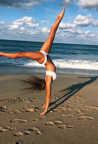 3. Gorgeous Olivia Dunne in Alluring White Bikini at the Beach while doing Fitness Exercises