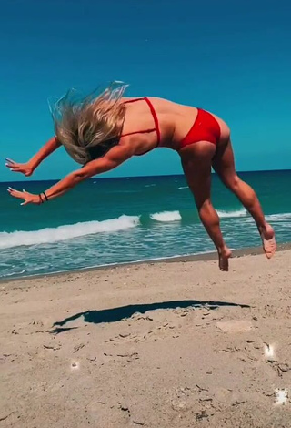 2. Pretty Olivia Dunne in Red Bikini at the Beach while doing Fitness Exercises