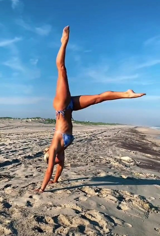 2. Breathtaking Olivia Dunne in Bikini at the Beach while doing Fitness Exercises