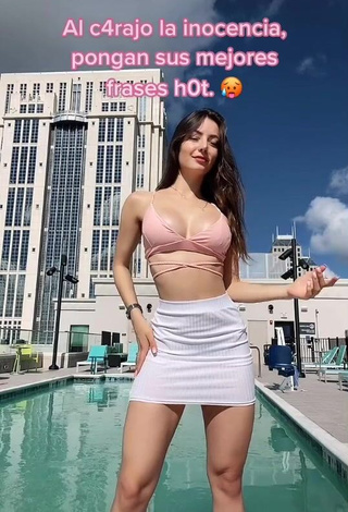 1. Irresistible Andrea Caro Shows Cleavage in Pink Crop Top at the Swimming Pool