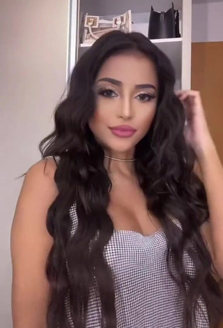 Captivating Nanda Caroll Shows Cleavage in Silver Crop Top