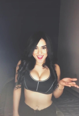 2. Irresistible Ónice Flores Shows Cleavage in Black Sport Bra