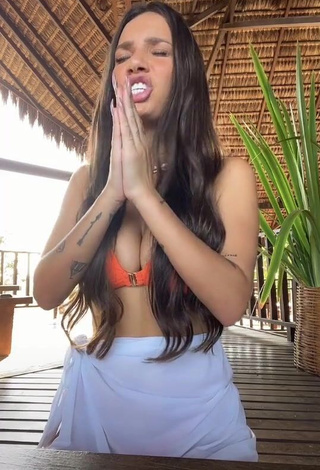 Erotic Stéfani Bays Shows Cleavage in Orange Bikini Top