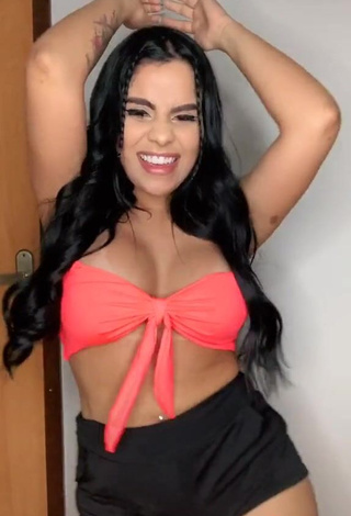 2. Irresistible Tati Nunes Shows Cleavage in Orange Bikini Top