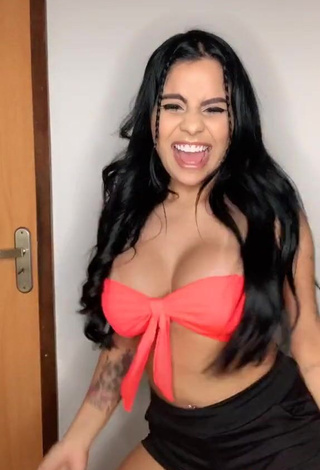 3. Irresistible Tati Nunes Shows Cleavage in Orange Bikini Top