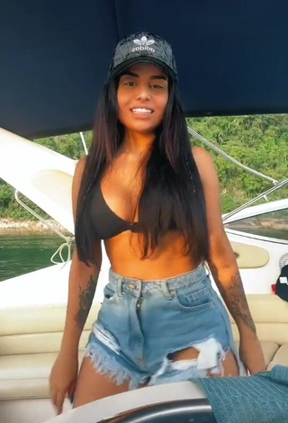 1. Cute Tati Nunes Shows Cleavage in Black Bikini Top on a Boat