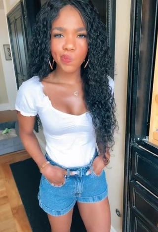 3. Captivating Teala Dunn Shows Cleavage in White Top