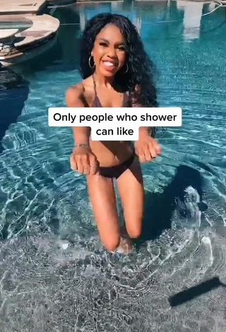 1. Teala Dunn in Appealing Black Bikini at the Pool