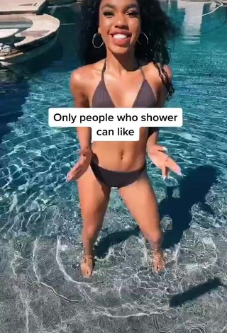 Teala Dunn in Appealing Black Bikini at the Pool