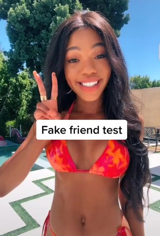 2. Breathtaking Teala Dunn Shows Cleavage in Bikini at the Pool