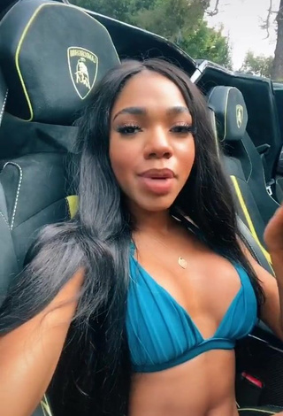 Irresistible Teala Dunn Shows Cleavage in Blue Bikini Top in a Car