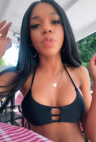 3. Captivating Teala Dunn Shows Cleavage in Black Bikini Top