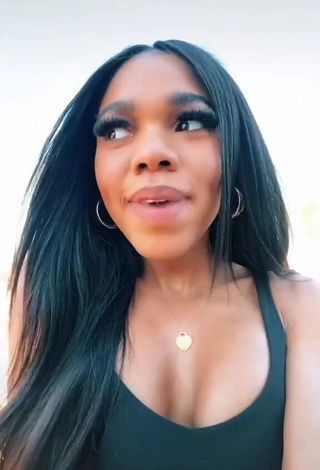 1. Irresistible Teala Dunn Shows Cleavage in Black Top