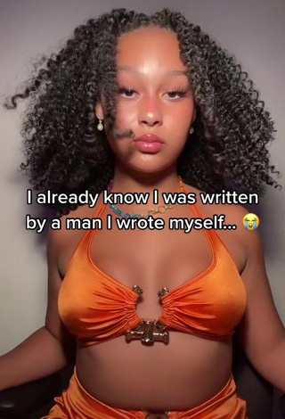 Hot Veondre Mitchell Shows Cleavage in Orange Crop Top