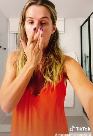 3. Erotic Ingrid Guimarães Shows Cleavage in Orange Top