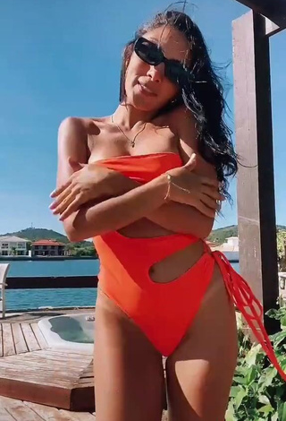 3. Erotic Isadora Nogueira Shows Cleavage in Orange Swimsuit in the Sea