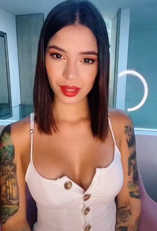 1. Beautiful Jenn Muriel Shows Cleavage in Sexy White Dress