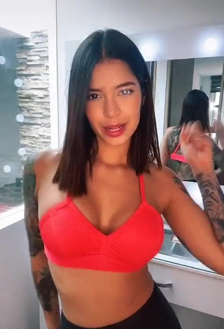 1. Seductive Jenn Muriel Shows Cleavage in Orange Sport Bra and Bouncing Tits