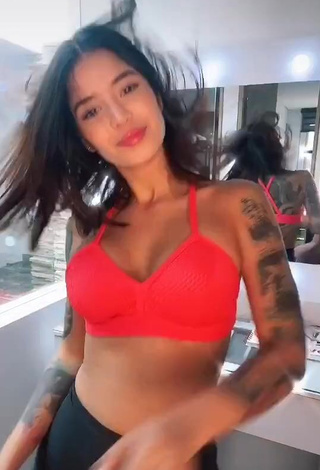 Seductive Jenn Muriel Shows Cleavage in Orange Sport Bra and Bouncing Tits