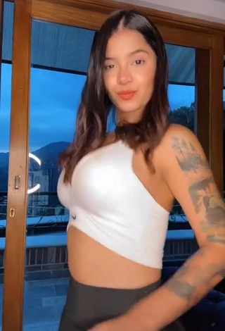 Sexy Jenn Muriel Shows Cleavage in White Crop Top