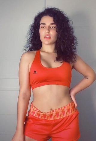 1. Irresistible Kefera Buchmann Shows Cleavage in Orange Sport Bra