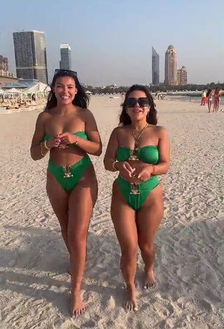 Erotic Nourhène Shows Cleavage in Green Bikini at the Beach