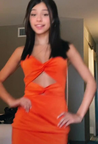 2. Irresistible Rachel Brockman in Orange Dress