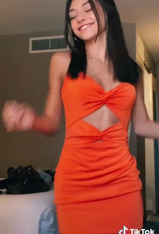 3. Irresistible Rachel Brockman in Orange Dress