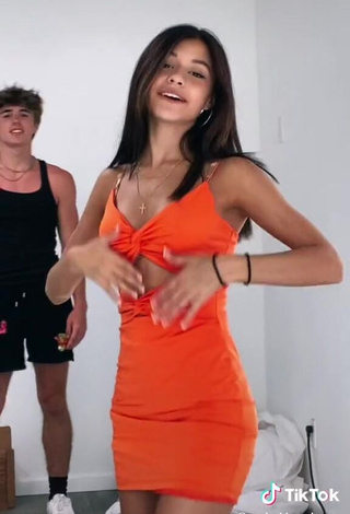 3. Erotic Rachel Brockman Shows Cleavage in Orange Dress