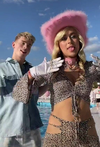 3. Irresistible Bad Barbie Shows Cleavage in Leopard Crop Top