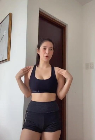 2. Erotic Barbie Imperial Shows Cleavage in Black Sport Bra